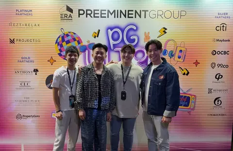 Four people in front of an ERA Preeminent Group event wall that lists ProjectSG among its partners